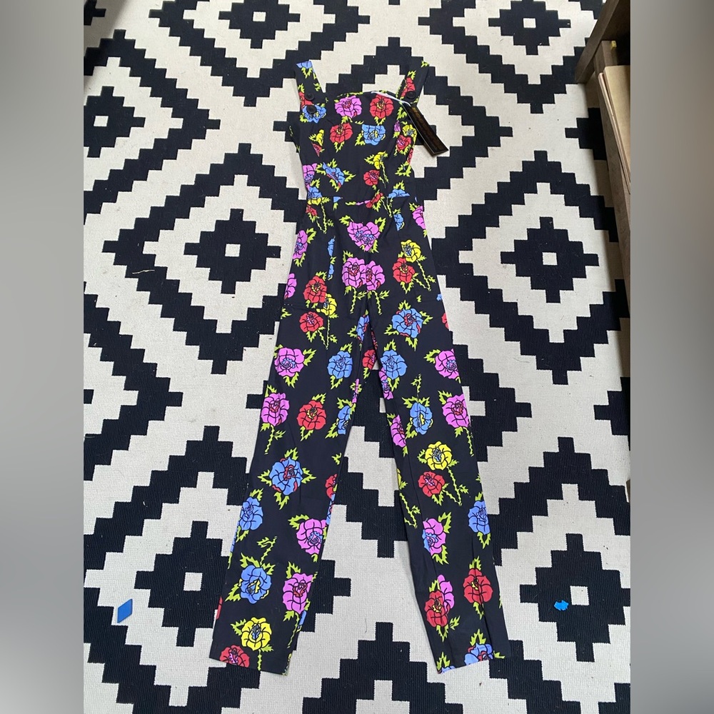 Nooworks overalls in rose print.